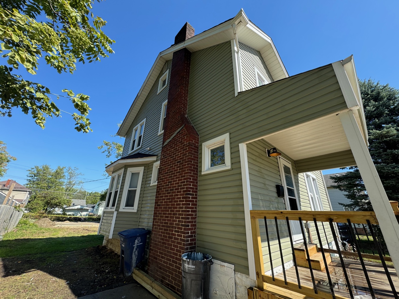 Soft-washed vinyl two-story home on a large tree-shaded lot in Pataskala, OH